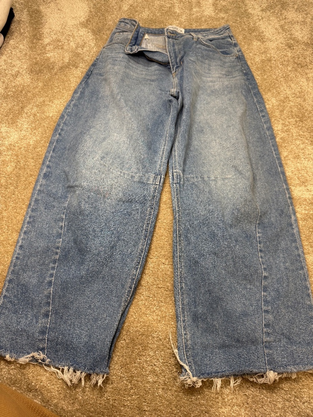 relaxed barrel leg denim, raw hem